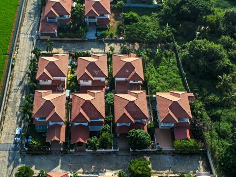 Red roofs in residential area housing, view from the air